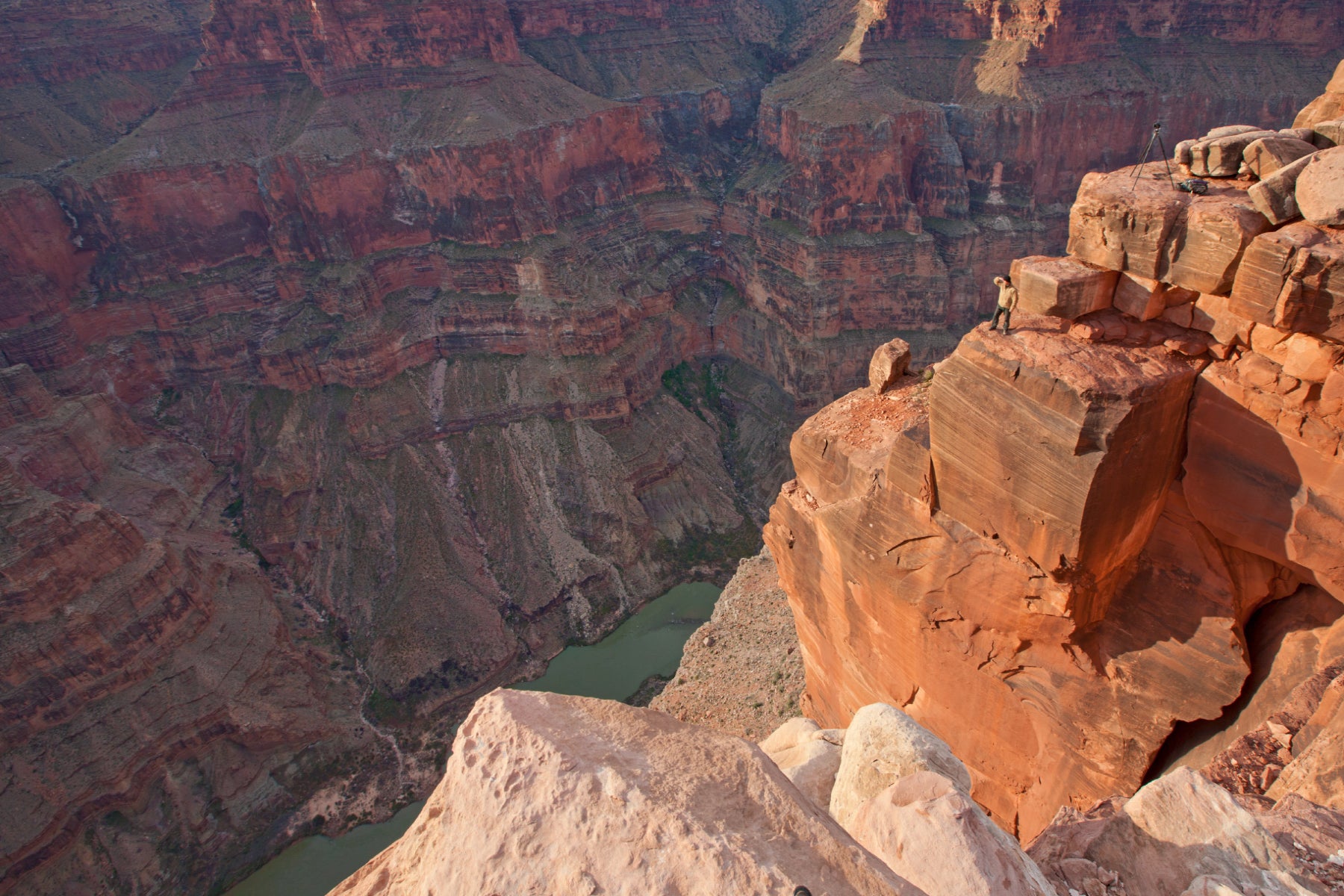 Portrait of Peter Lik standing on the cliffs of Toroweap Overlook at the Grand Canyon National Park in Arizona.