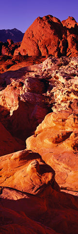 Red and orange sunlit sandstone formations and canyons of Valley of Fire State Park Nevada