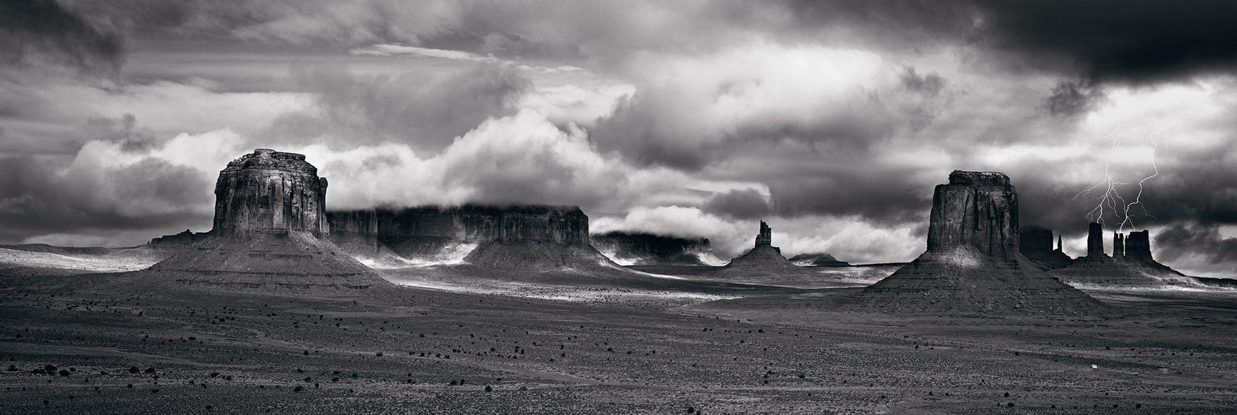 Cloud covered stone buttes of Monument Valley Arizona during a thunder storm