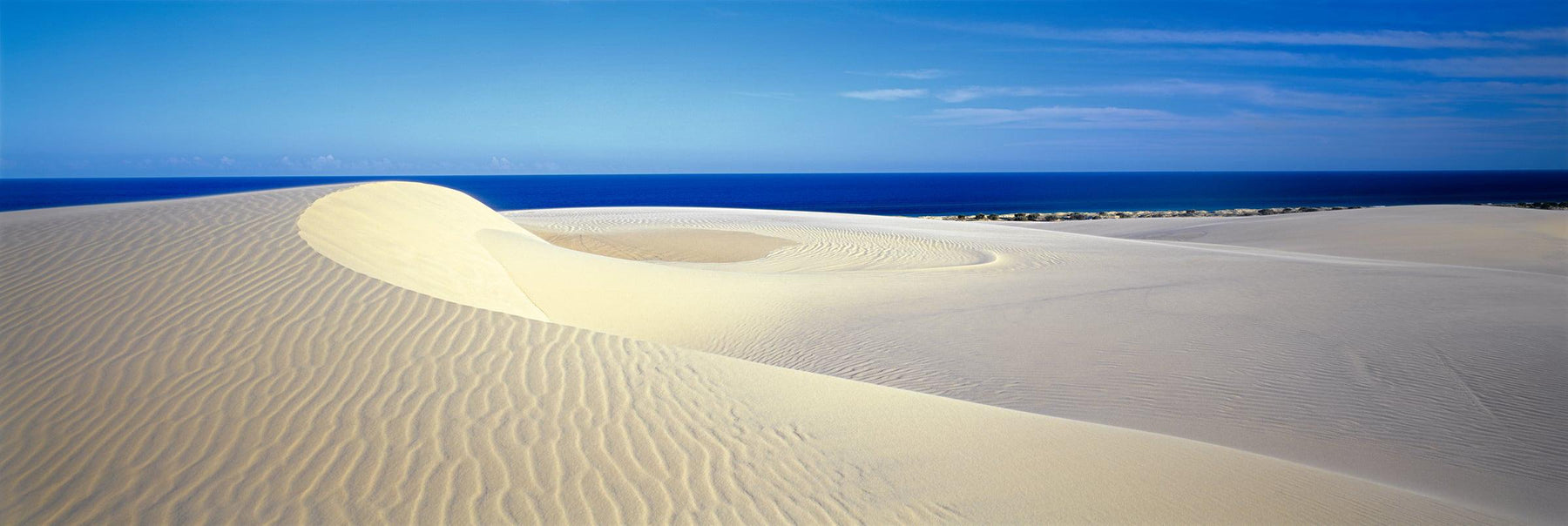 Beige sand dunes along the coast of Fraser Island National Park Australia