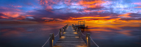 Photograph from Peter Lik of a dock under a sunset titled Heavenly Night | LIK Fine Art