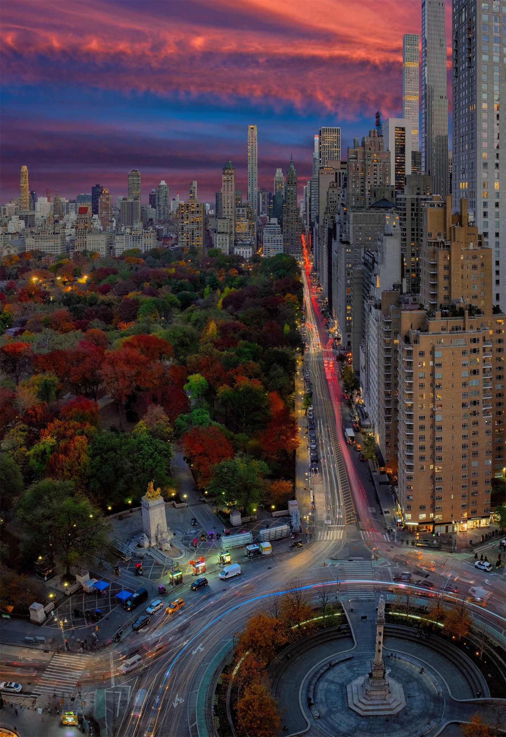 Photograph from Peter Lik of a roundabout in a city with skyline in background titled Magical City | LIK Fine Art