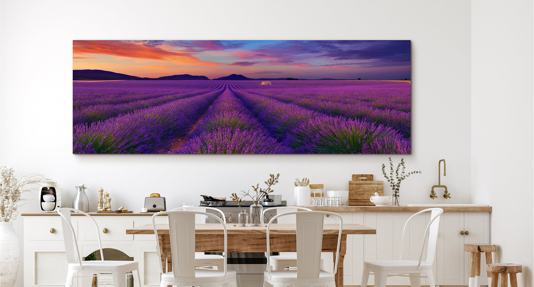 Peter Lik image of purple rows of lavender leading to a shack and mountains under a cloudy sky at sunset in Valensole France hanging on the wall of a kitchen 