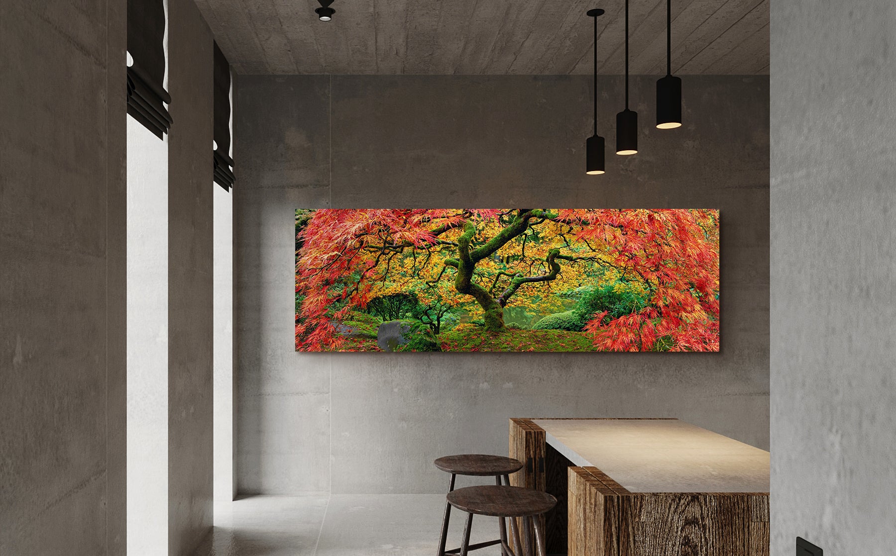 Large Peter Lik photograph of a colorful Japanese Maple tree hanging on a concrete wall near a table