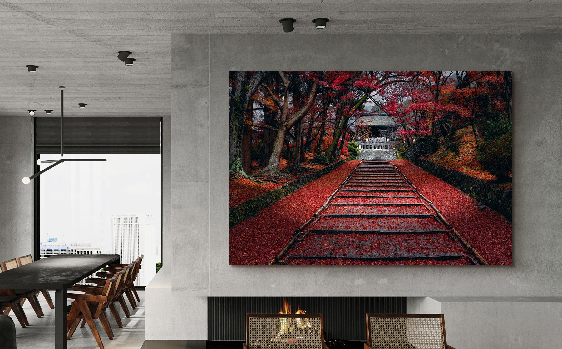 Large Peter Lik photograph of red leaves along a pathway hanging on a large concrete wall above a fireplace 