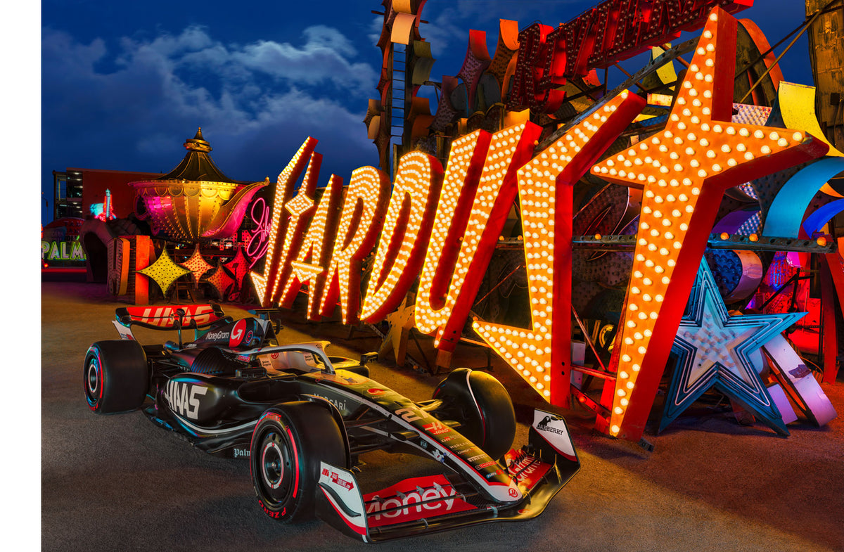 LIK Fine Art photograph of the MoneyGram Haas F1 Team car in front of the Stardust sign in The Neon Museum.