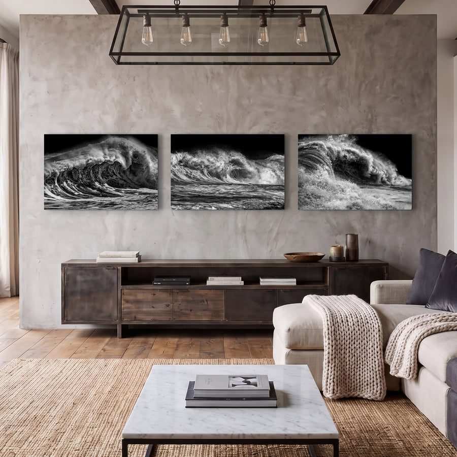 Luxury living room displaying Frequency, a three-piece black and white ocean wave photography collection photographed at Newport Beach, California.