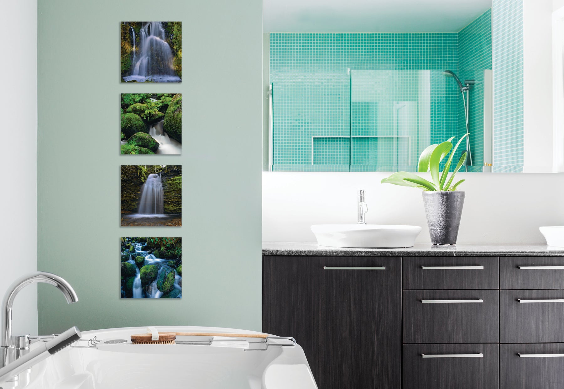 Modern residential bathroom with seafoam green walls and tile and dark wood vanity featuring four square photographs of waterfalls by Peter Lik