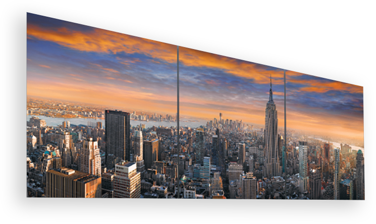 Framed three panel photograph of the Manhattan, New York skyline at twilight featuring the Empire State Building
