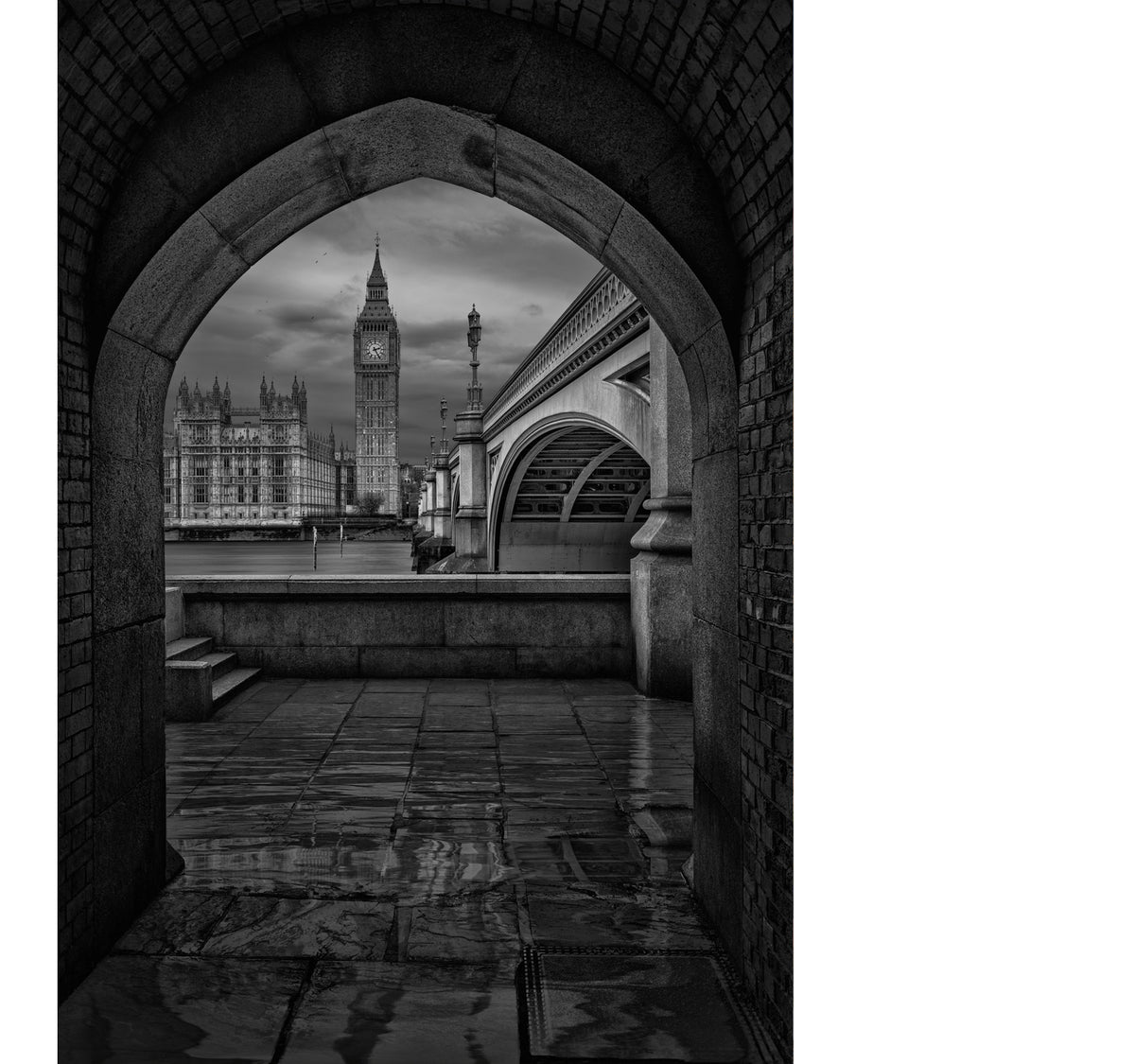 Peter Lik black-and-white, limited edition photograph of a striking  view of Big Ben, framed by an ancient passage along the River Thames.