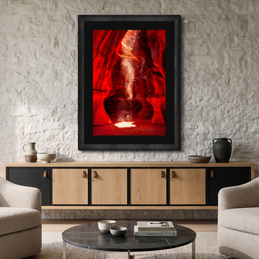 Spirit by Peter Lik displayed in a black frame above a modern console in a contemporary living room with stone walls and neutral décor.