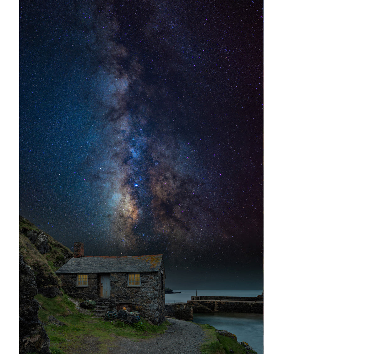 Peter Lik limited edition photograph of a seaside cabin standing
watch over a secluded cove as the Milky Way lights up the sky, filling the scene with a profound sense of awe and peaceful serenity.