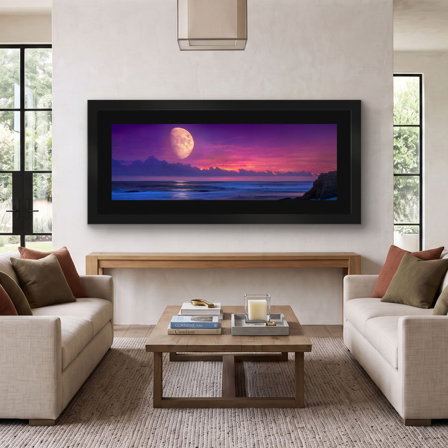 Twilight Whisper by Peter Lik displayed in a modern living room, featuring a vivid moonlit ocean sunset in purple, pink, and blue tones.