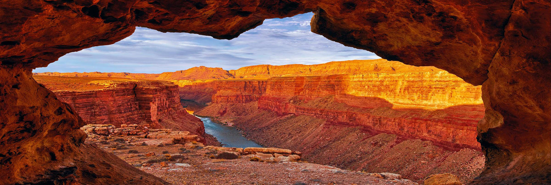 Looking out from a cave across the cliffs and Colorado River within the Grand Canyon Arizona