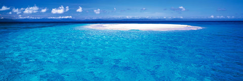 White sand of Upolu Cay surrounded by the turquoise ocean in Queensland Australia
