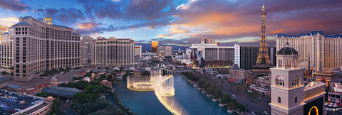 Balcony view of the Las Vegas strip overlooking the fountains of Bellagio and Paris Hotel