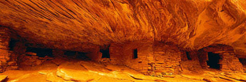 Ancient Anasazi ruins built into the rock walls off a plateau in Cedar Mesa Utah