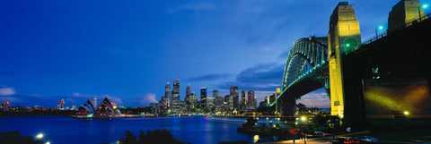 Sydney Harbour Bridge at twilight with The Opera and city of Sydney Australia in the background