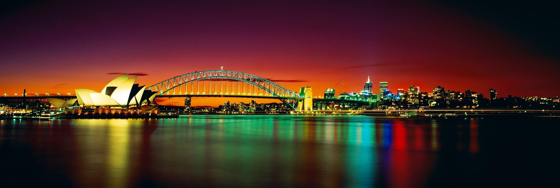 Sydney Harbor Bridge Sydney Opera House and Sydney reflecting on the harbor at night