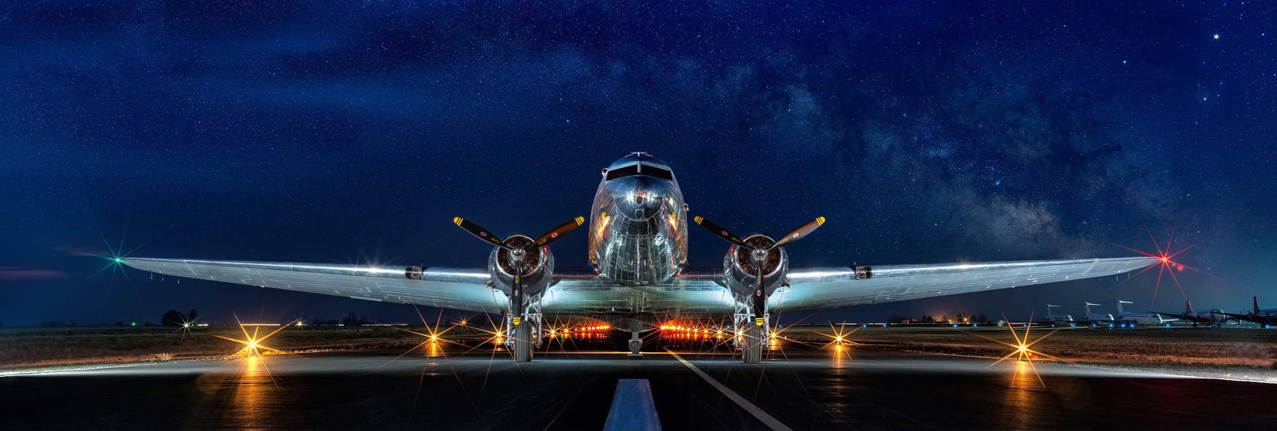 Photograph from Peter Lik or an airplane ready to take flight titled Midnight Flight | LIK Fine Art