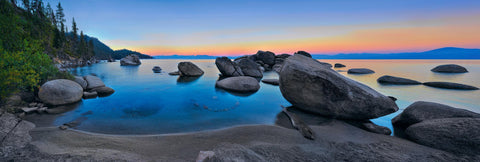 Boulders in a cove and along the shore of Lake Tahoe California at sunset