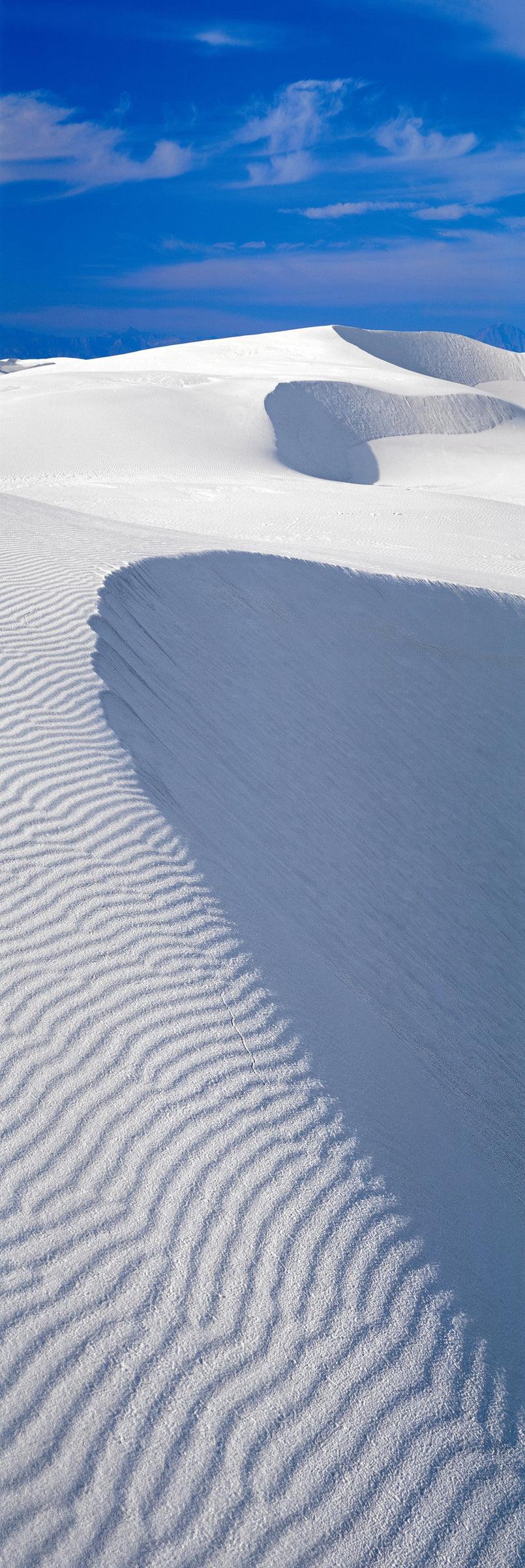 Windswept sand dunes with blue skies in the White Sand Dunes National Monument New Mexico