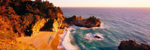 McWay Falls dropping off a cliff to the sandy beach at Julia Pfeiffer Burns State Park California