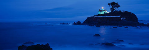 Battery Point Lighthouse in Crescent City California lit up before sunrise