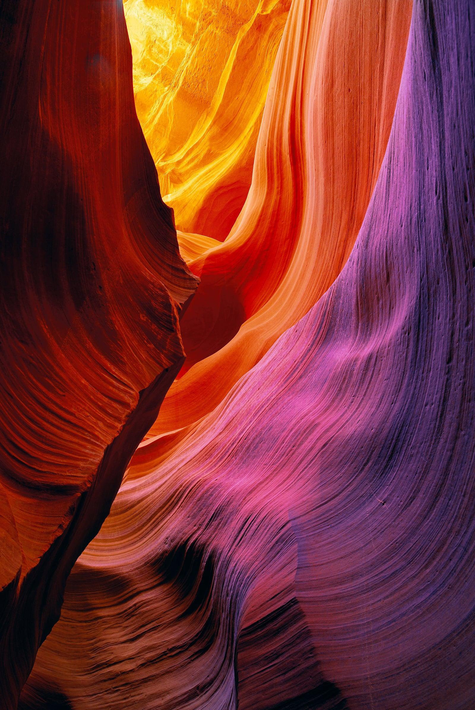 Red and pink wave shaped sandstone walls of the slot canyons in Antelope Canyon Arizona